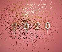 Candles spelling out '2020' surrounded by glitter
